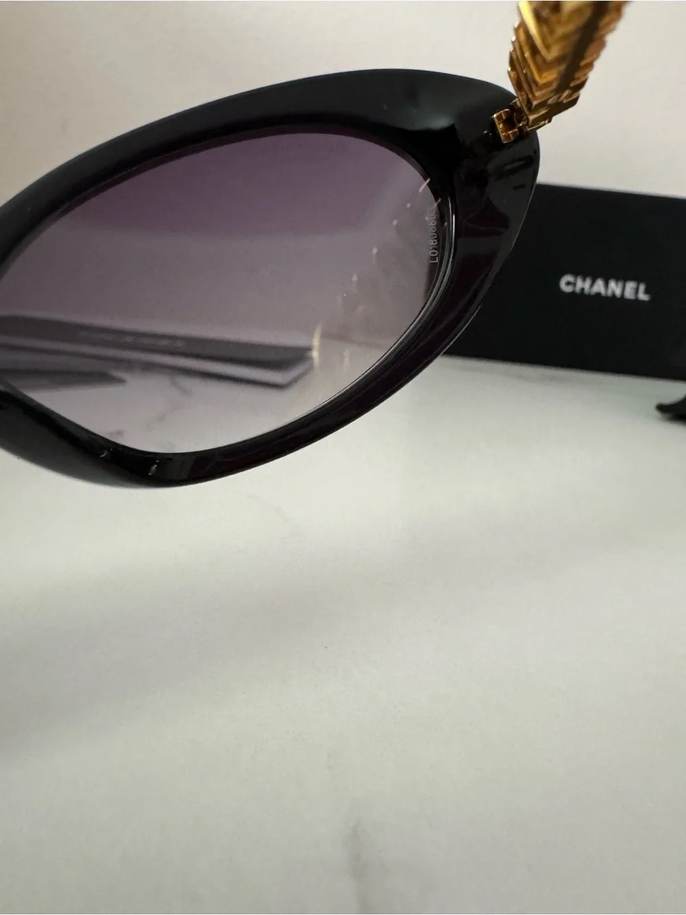 CHANEL Black Oval Sunglasses with Gray Gradient Lenses
